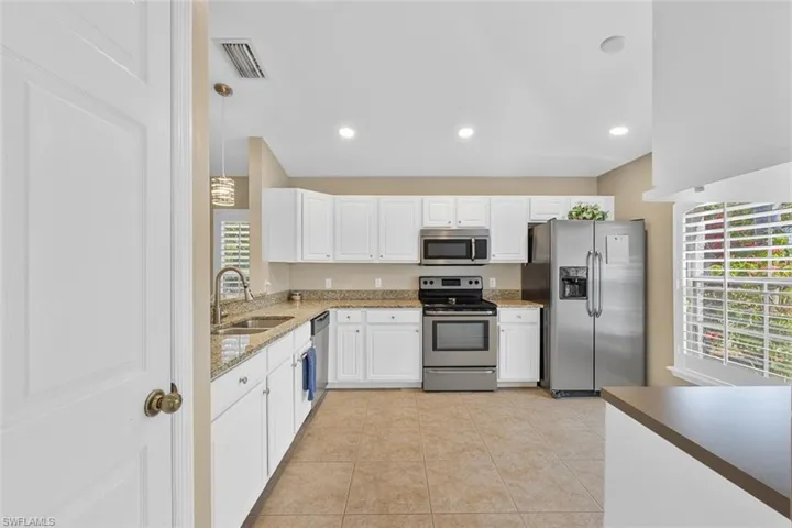New custom cabinetry, granite countertops, & stainless steel appliances.