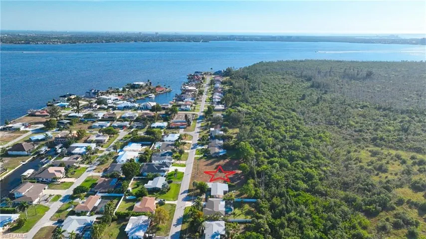 Aerial view of residential area with a large body of water