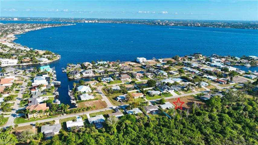 Aerial view of residential area with a large body of water