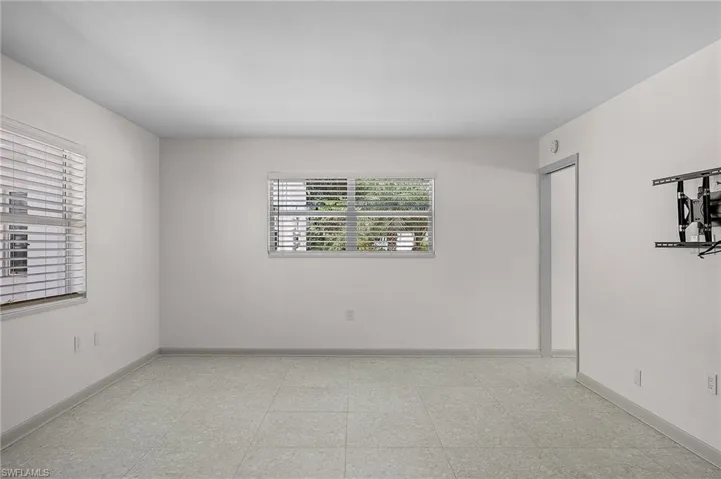 Unfurnished room with baseboards