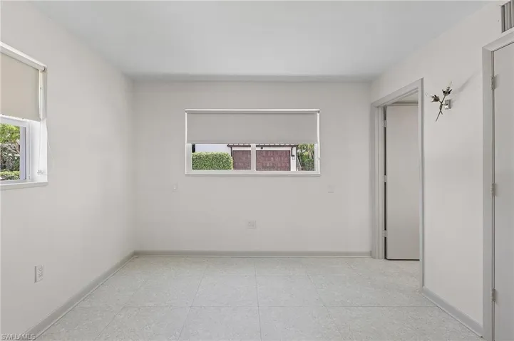 Unfurnished room featuring healthy amount of natural light