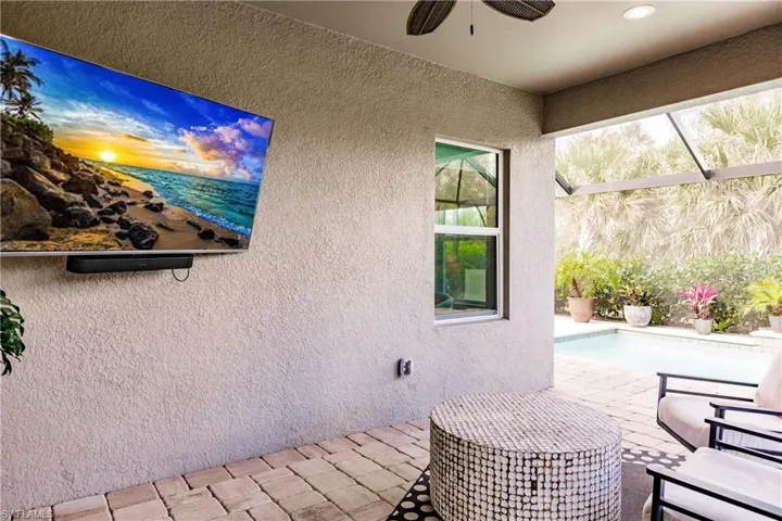 View of patio / terrace with an outdoor pool and a ceiling fan