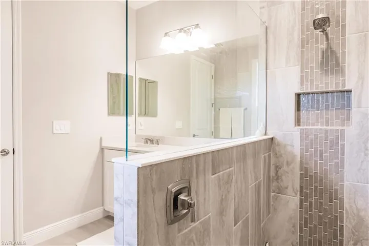 Bathroom with walk in shower and double vanity