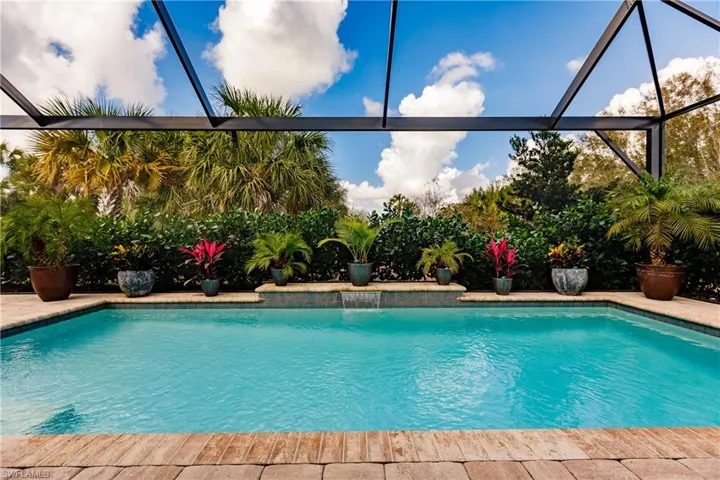 Swimming pool with glass enclosure and a sunroom