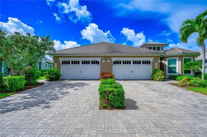 View of front of property with a garage