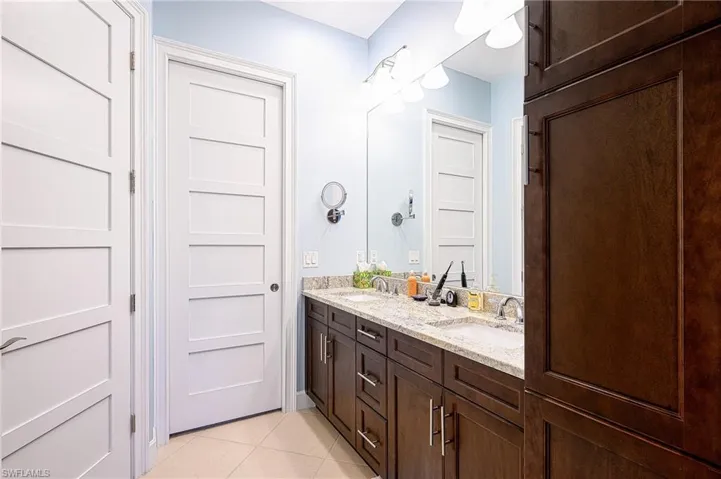 Bathroom featuring tile patterned flooring and vanity