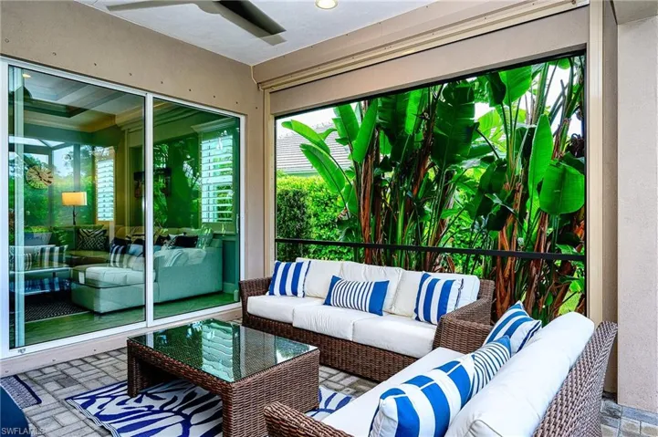 Sunroom / solarium featuring ceiling fan