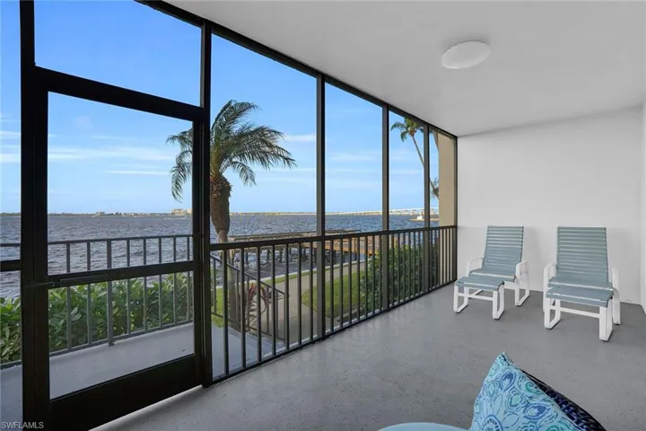 Sunroom / solarium with a water view