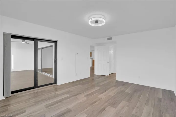 Unfurnished bedroom with light wood finished floors