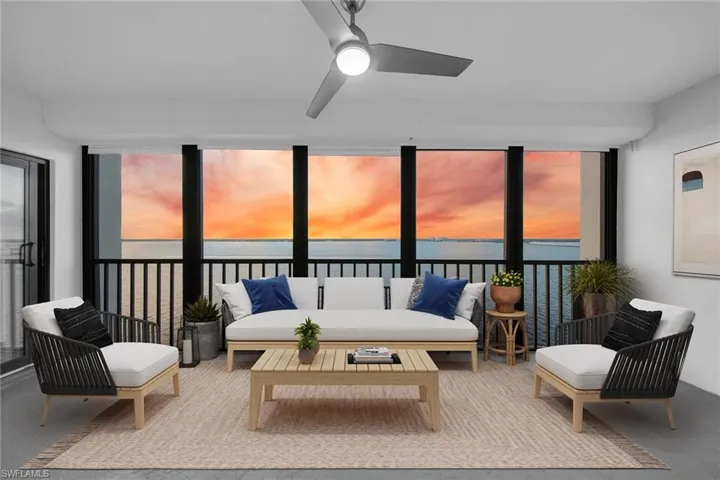 Sunroom / solarium with a water view, healthy amount of natural light, and concrete floors **PHOTO IS VIRTUALLY STAGED**