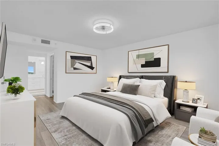Bedroom with light wood-style floors **PHOTO IS VIRTUALLY STAGED**