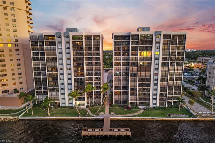 View of apartment building / complex featuring a water view