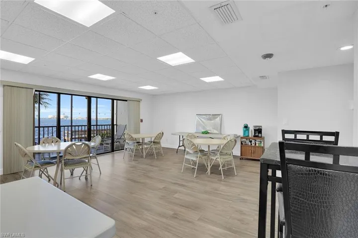 Dining area with light wood-style flooring and a paneled ceiling