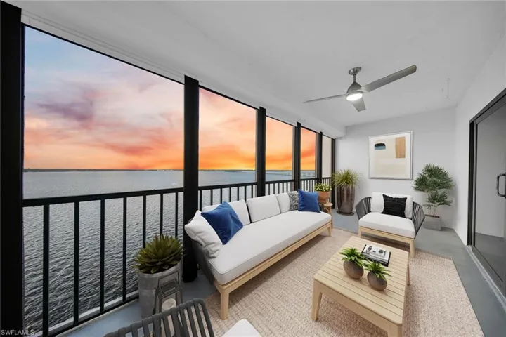 Sunroom / solarium featuring a water view and concrete floors **PHOTO IS VIRTUALLY STAGED**