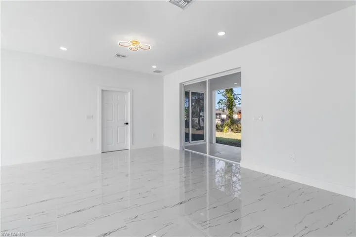 Spare room with recessed lighting and light marble finish flooring