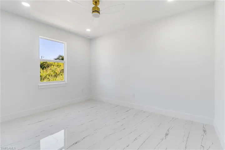 Unfurnished room featuring recessed lighting and ceiling fan