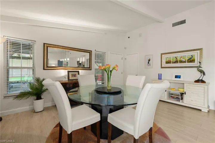 Dining room featuring wood finished floors and baseboards