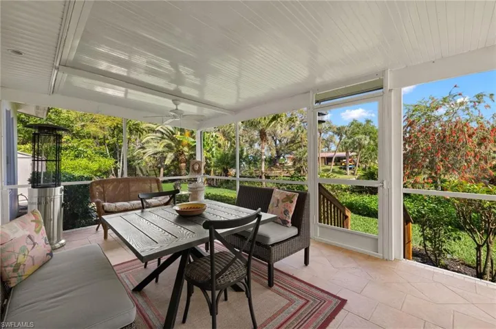 Sunroom featuring a ceiling fan and healthy amount of natural light