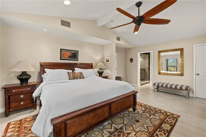 Bedroom featuring a ceiling fan, light wood-type flooring, connected bathroom, and recessed lighting