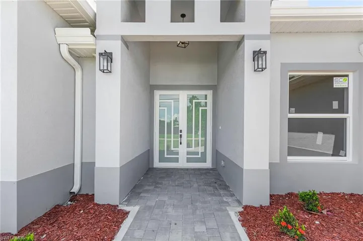Doorway to property featuring french doors