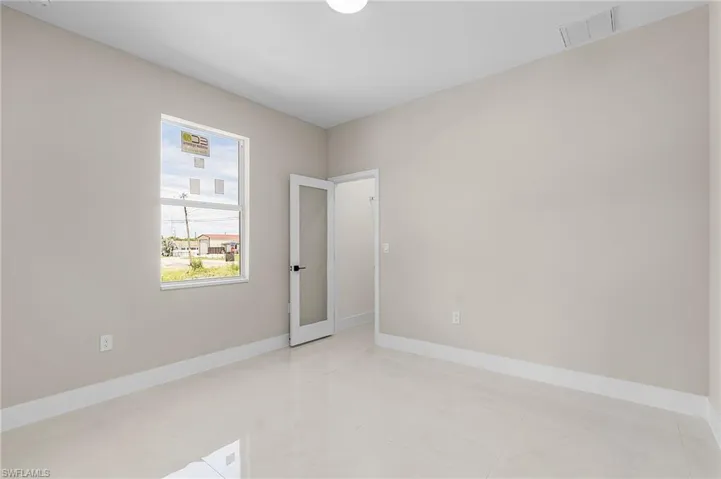 Spare room with light tile patterned floors