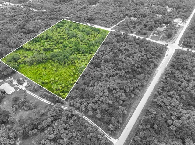 Aerial view of property and surrounding area with property boundaries highlighted