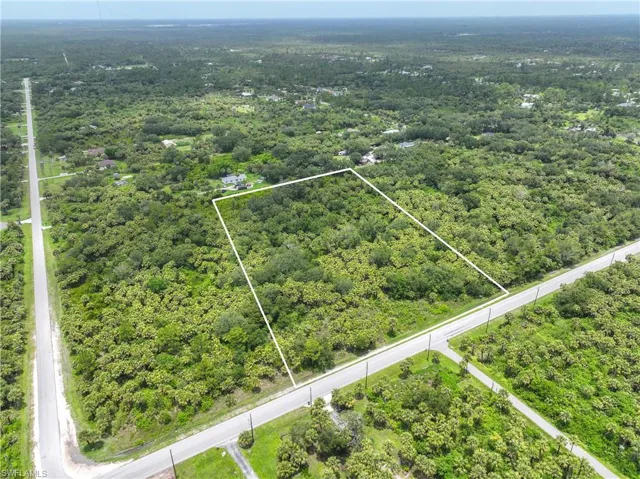 View of property location with property boundaries highlighted and a forest
