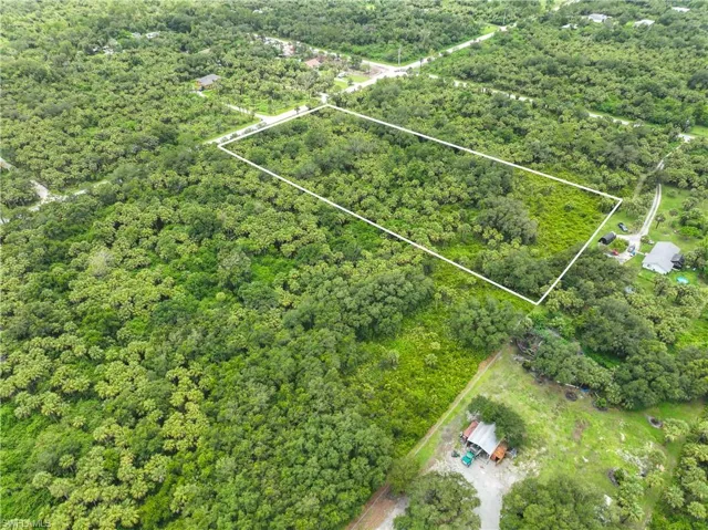 Aerial overview of property's location with property parcel outlined