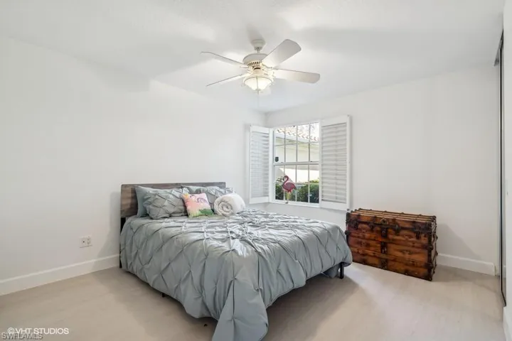 Bedroom featuring light wood-type flooring and ceiling fan