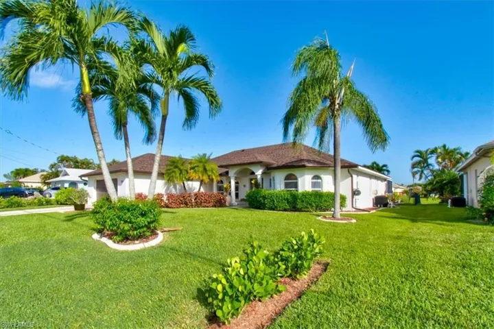 Well manicured Florida home with tropical landscaping