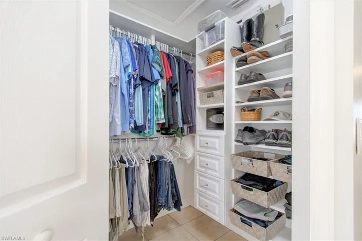 Walk in closet featuring light tile patterned flooring