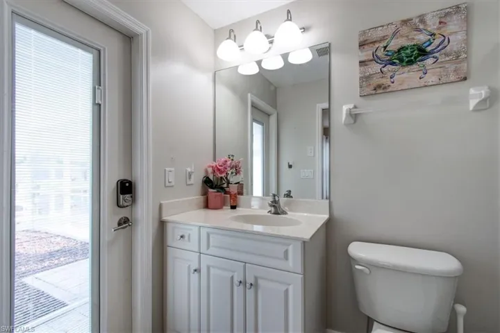 Bathroom featuring french door to pool