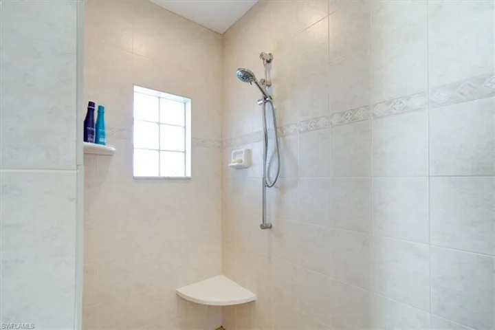Full bathroom with tiled shower