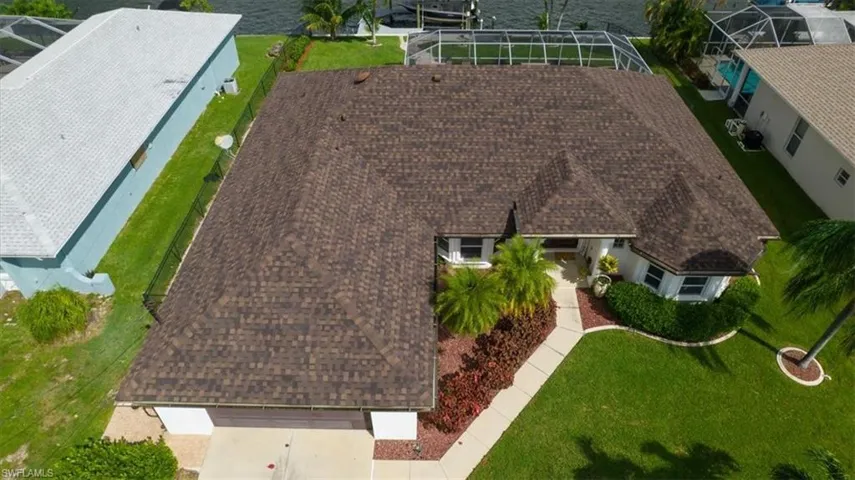 Overhead view at front of home with two car garage.