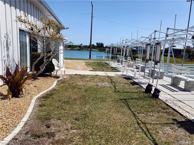 View of BACK CLUBHOUSE with a water view