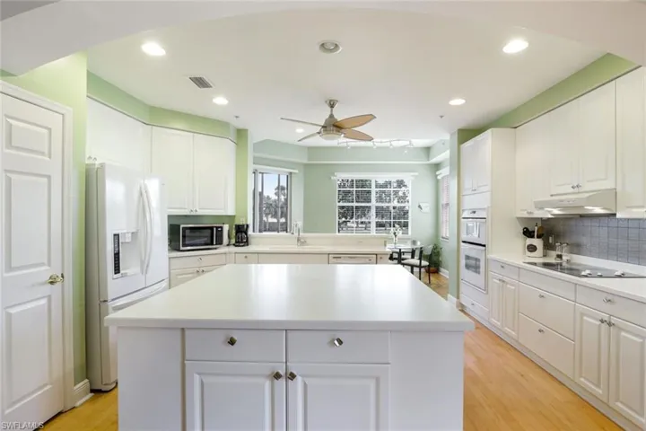 Kitchen view toward kitchen dining area.