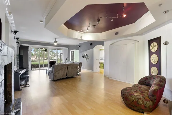 Very spacious great room with two sitting areas. One by the fireplace and one by the entertainment center.