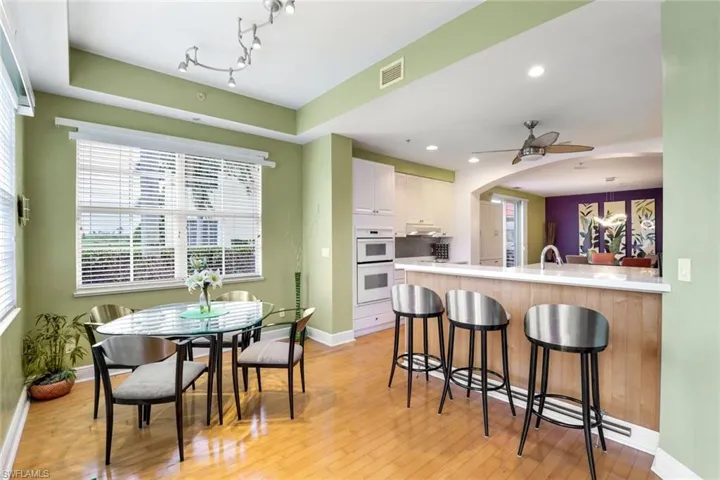 Kitchen has an eat-in area and breakfast bar.