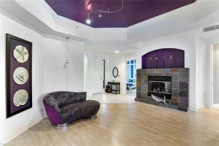 Other side of the great room with a fireplace.