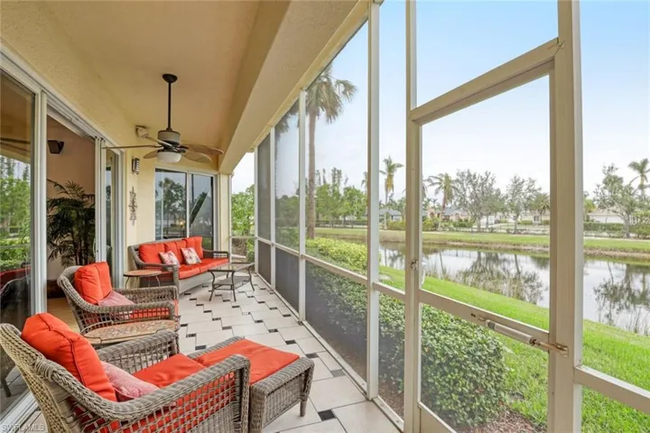 Screened patio off of the great room and kitchen with a view of the lake.
