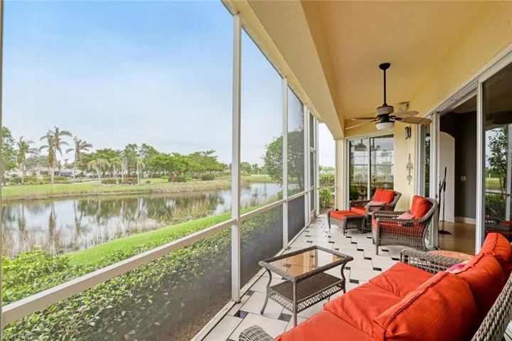 Screened patio off of the great room and kitchen with a view of the lake.