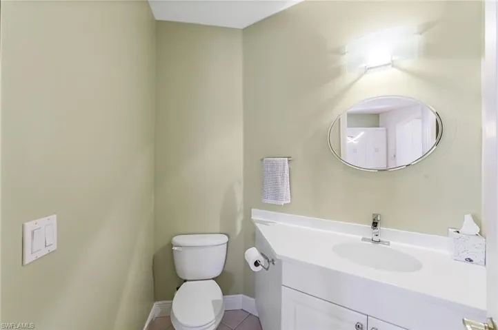 1/2 bathroom off of the kitchen and formal dining room.