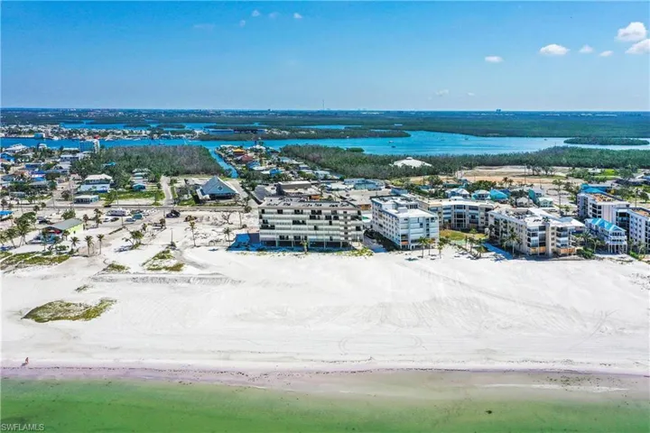 View of building from the Gulf - Ground Floor is for parking - this first floor condo is on the bottom left in this picture close to stairwell and elevator.