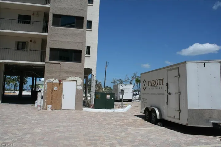 Front Stairwell to enter for showings. Picture also shows Construction Trailer - work has started