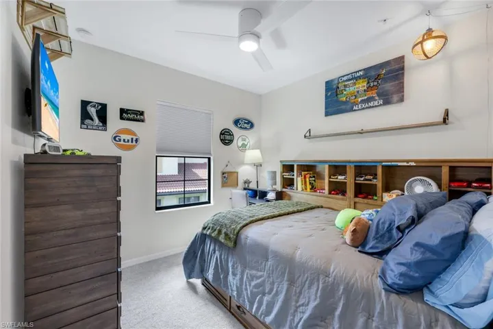 Bedroom with carpet floors and a ceiling fan