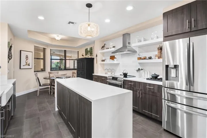 COMPLETE REMODEL! Custom shelving, subway tile backsplash, porcelian plank tile.GE cafe appliances, bosch dishwasher, soft close drawers. Lots of cabinet space with this new design!