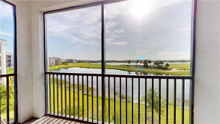 Unfurnished sunroom featuring a water view