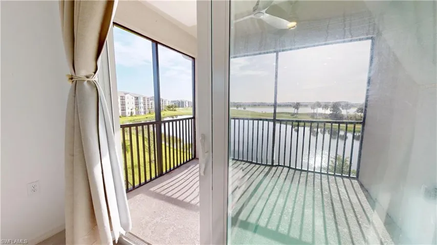 Unfurnished sunroom with a water view