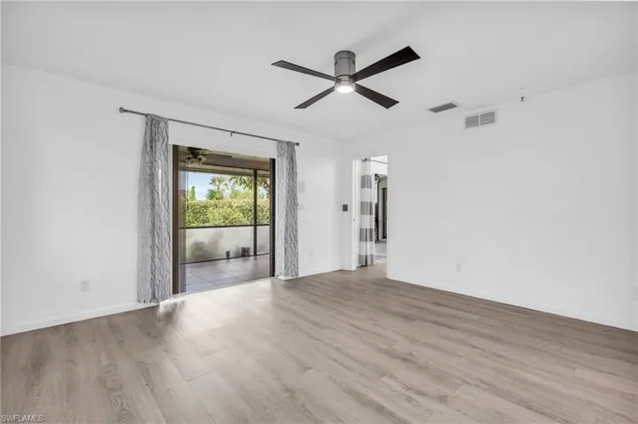 Unfurnished room featuring light hardwood / wood-style flooring and ceiling fan