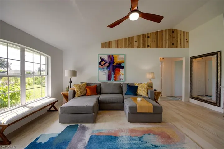 Living room with high vaulted ceiling